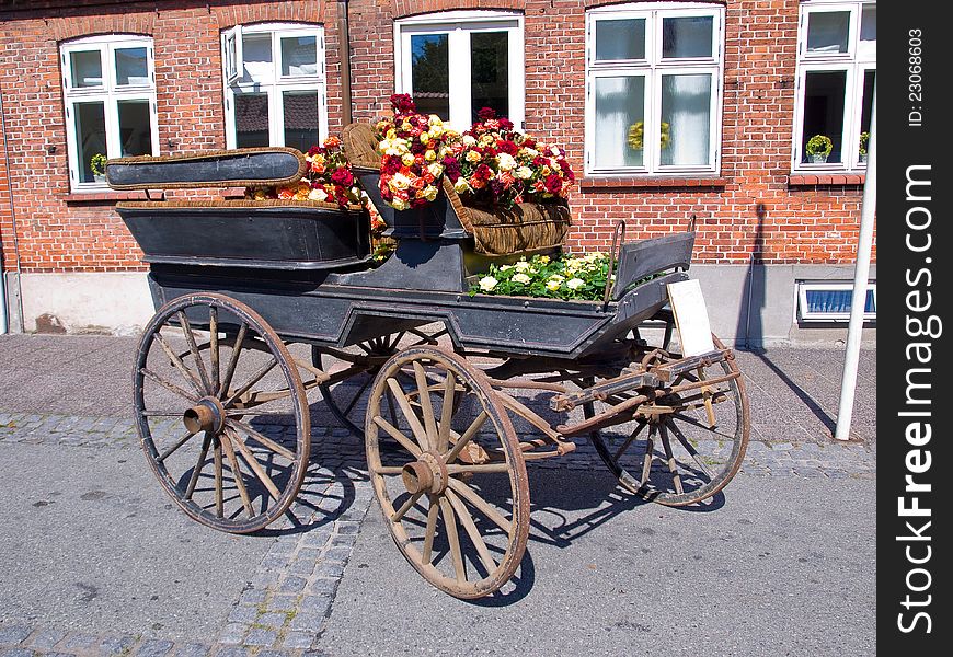 Horse carriage decorated with many colorful flowers. Horse carriage decorated with many colorful flowers