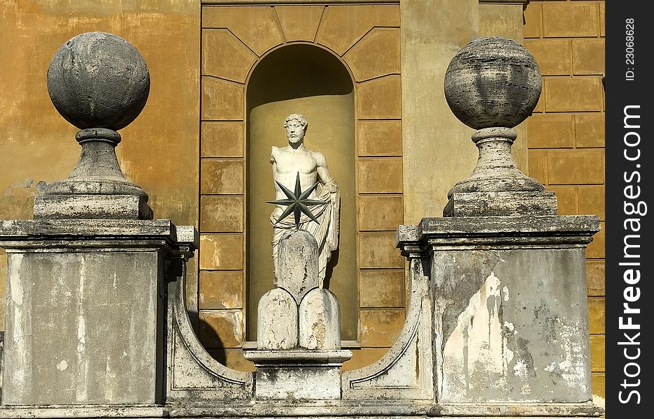 Stone balls and antique sculpture in the courtyard in the Vatican Museum