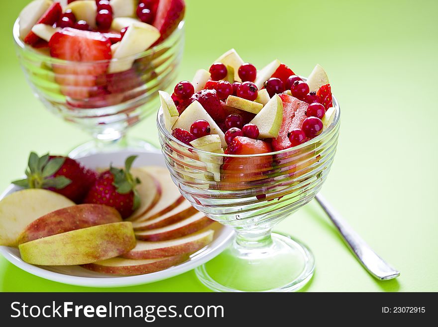 Photograph of two bowls of a colorful fruit salad. Photograph of two bowls of a colorful fruit salad