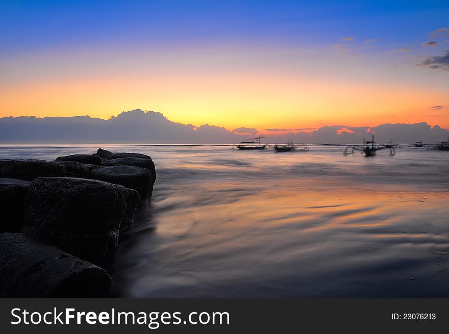 Ocean coast sunrise and fishing boats, Jimbaran, Bali. Ocean coast sunrise and fishing boats, Jimbaran, Bali