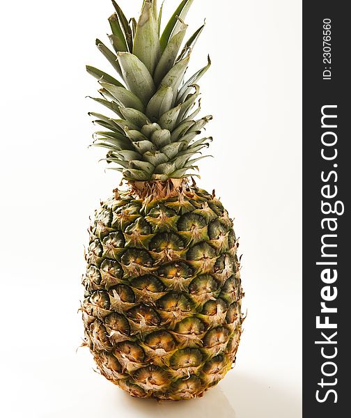 Fresh ripe pineapple photographed on white background. Fresh ripe pineapple photographed on white background