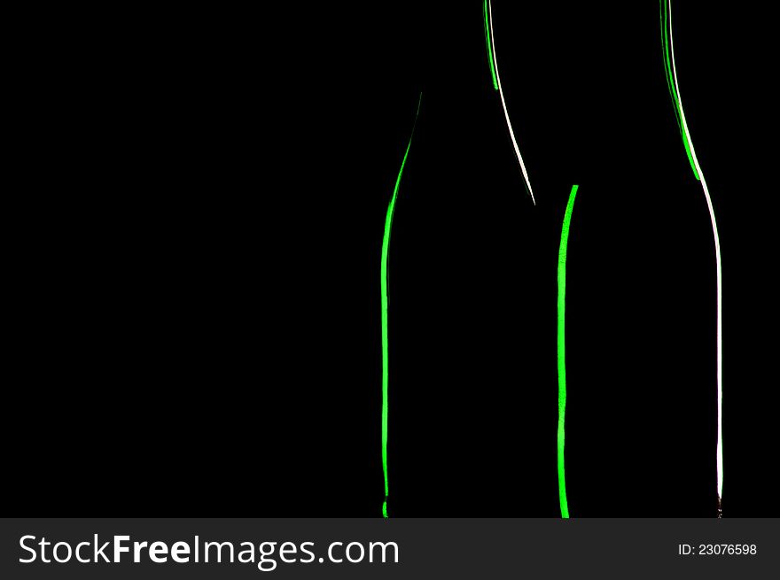 Two bottles on a black background