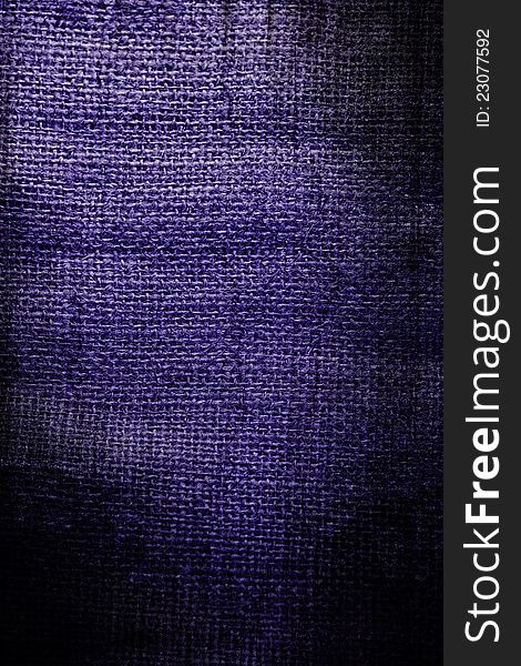 Fragment of rough violet textile background. Fragment of rough violet textile background