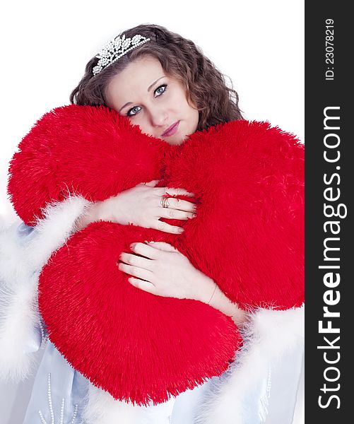 Girl hugs heart on a white background. Girl hugs heart on a white background