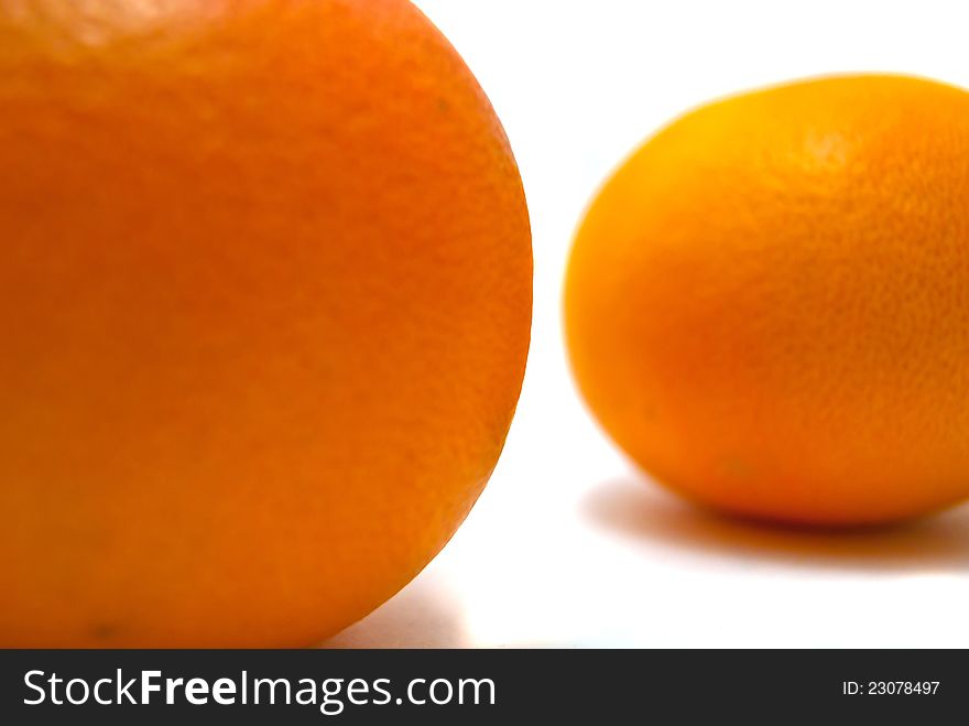 Two tangerine close-up on white