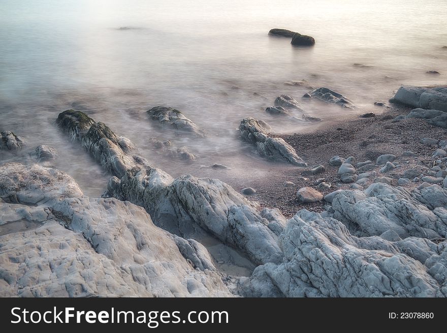 Seaside rocks, washed by waves, long-time exposure (~1min) hdr combined image. Seaside rocks, washed by waves, long-time exposure (~1min) hdr combined image