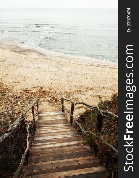 Wooden old stairs leading to the sea. Wooden old stairs leading to the sea