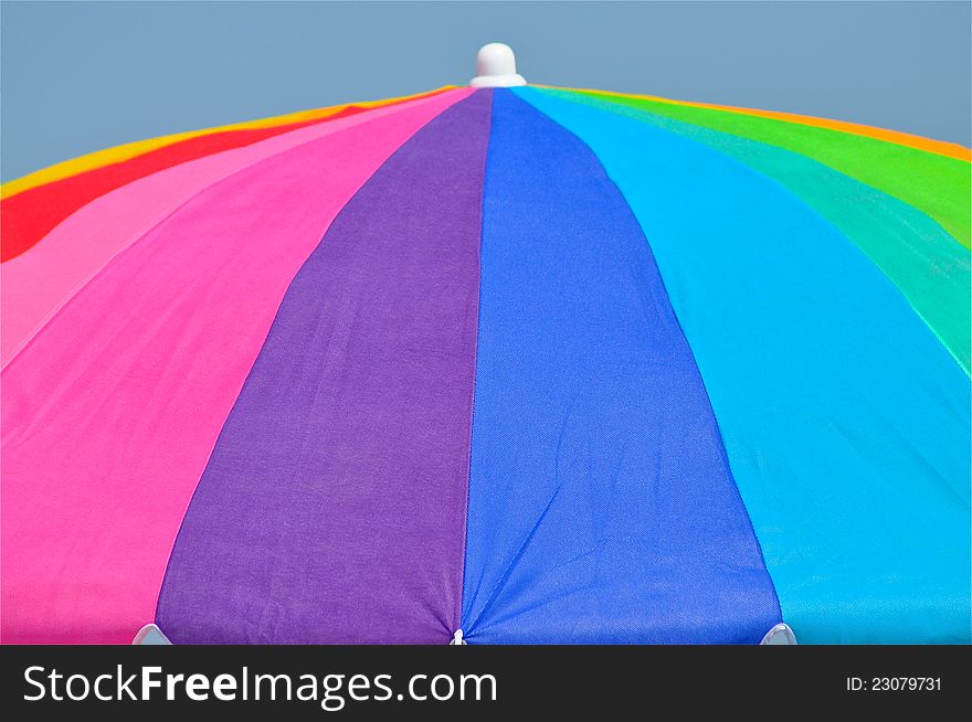 A closeup of a gigantic and colorful umbrella.