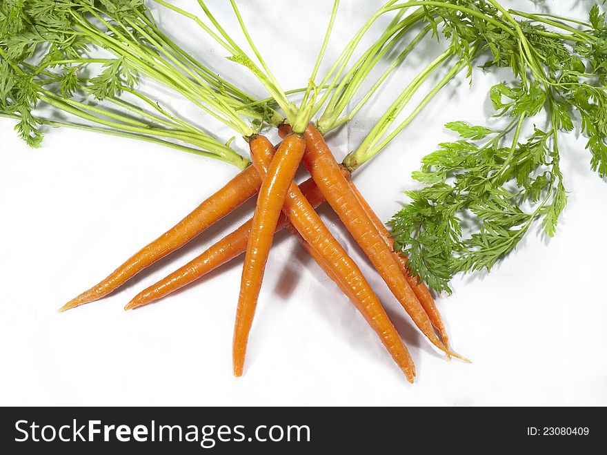 Carrots stacked in a crisscrossed pattern. Carrots stacked in a crisscrossed pattern