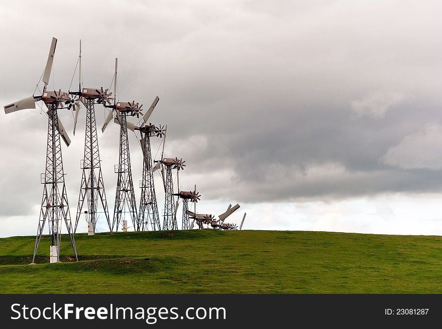 A photo of windmills. Converts wind mechanical energy to electrical energy. A photo of windmills. Converts wind mechanical energy to electrical energy.