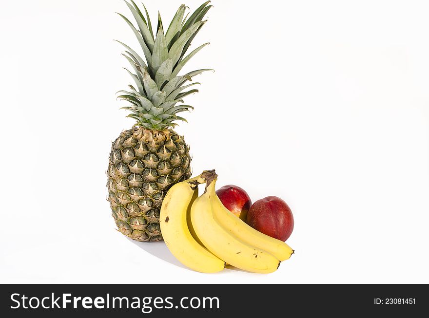 Studio photo of tropical fruits, bananas, pineapple, plums and melon. Studio photo of tropical fruits, bananas, pineapple, plums and melon