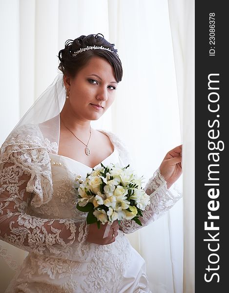 Happy bride with wedding bouquet