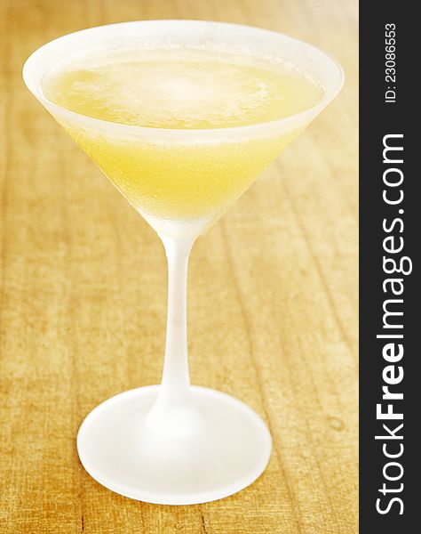 Orange colour cocktail on a wood background. Orange colour cocktail on a wood background