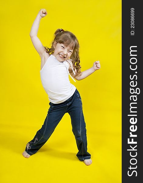 Cheerful girl dances.