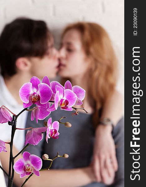 Flowers and young couple, selective focus