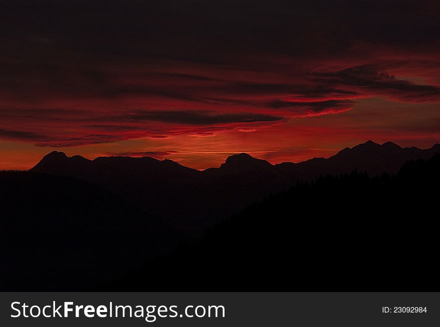 Red dramatic sunset on montain