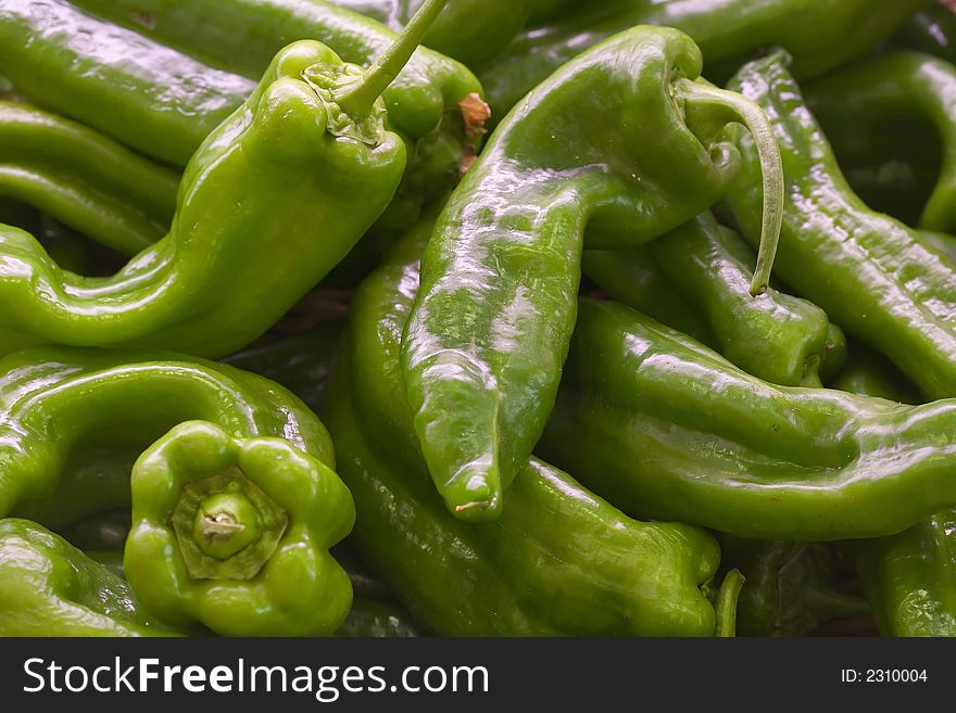 A box of fresh green pepper in a fruit shop. A box of fresh green pepper in a fruit shop