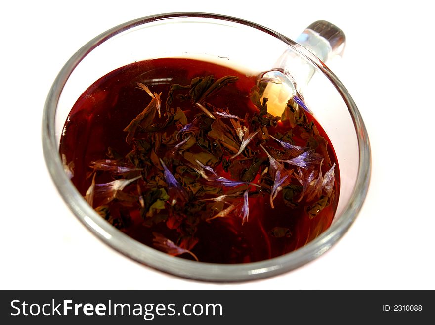 Cup with a flower tea, isolated on white