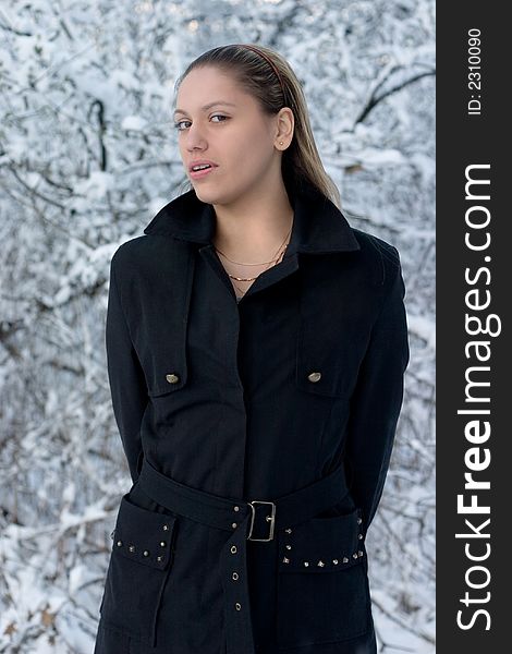 Young girl in black on light background. Young girl in black on light background