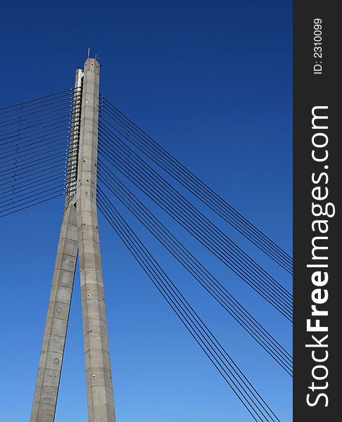 Suspension bridge against the blue sky (Riga, Latvia)