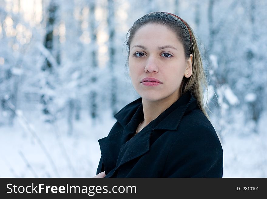 Beautiful girl on the winter background. Beautiful girl on the winter background