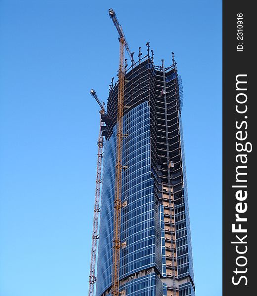 Modern building used for commercial purposes on the blue sky. Modern building used for commercial purposes on the blue sky