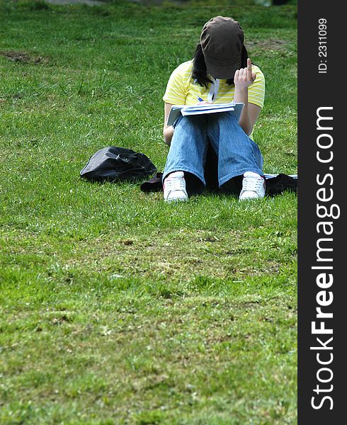 Young girl learning in park