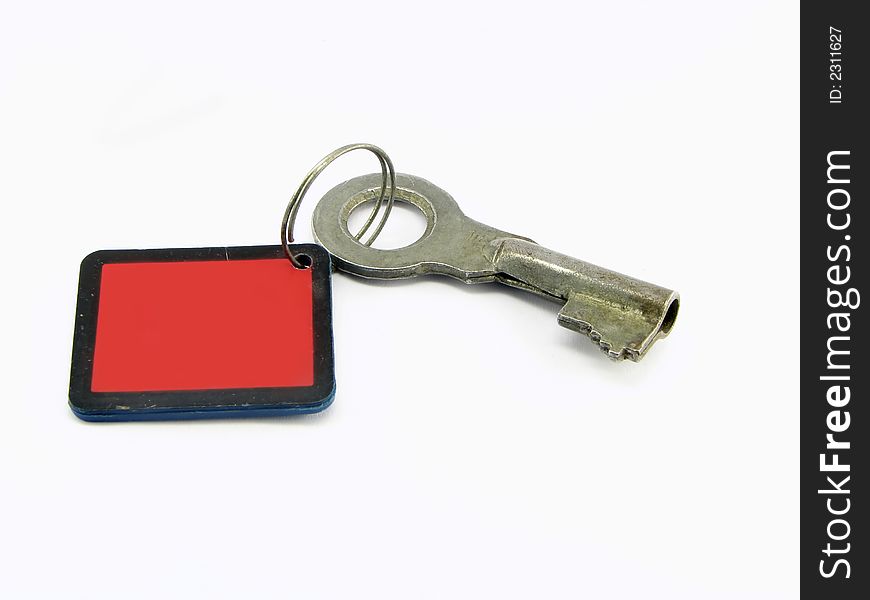 Key on the ring with the red tally, against the white background. Key on the ring with the red tally, against the white background.