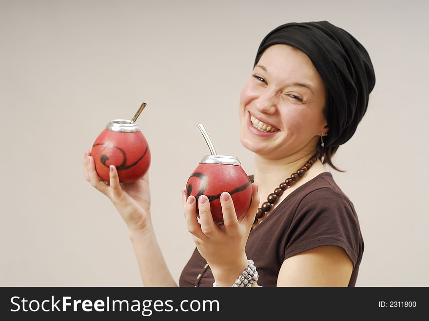 Young pretty smiling woman with calabash