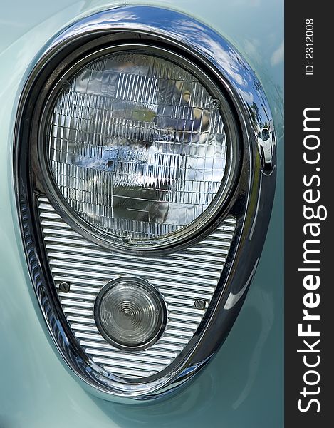 Closeup of classic vintage headlight on a 1950's US auto. Closeup of classic vintage headlight on a 1950's US auto
