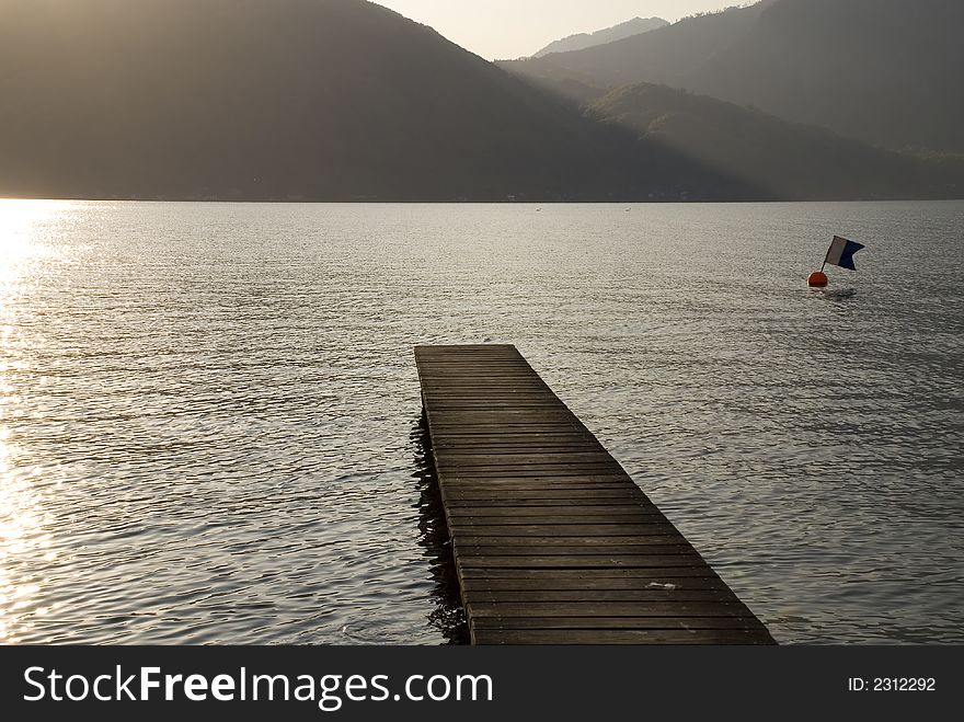 Footbridge leading into lake Traunsee in Austria.