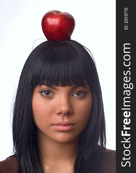 The girl with an apple on a white background