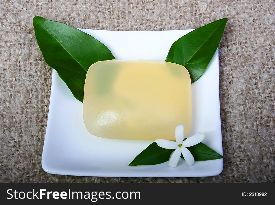 Digital photo of a soap with a flower.