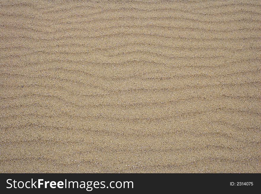 Close up of sand ripples on the beach for background. Close up of sand ripples on the beach for background