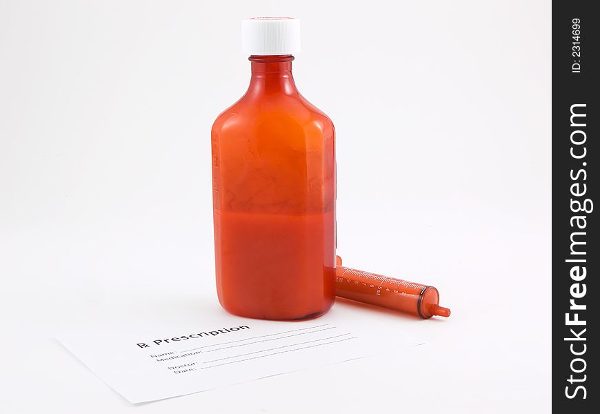 Photo of a bottle of medicine, syringe and a prescription