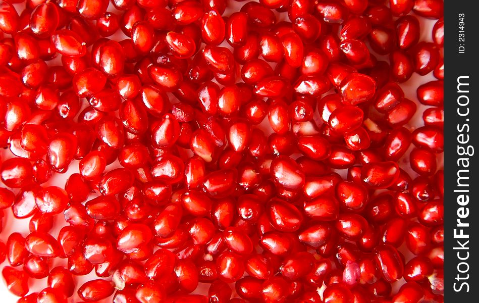 Red grains of pomegranate close-up