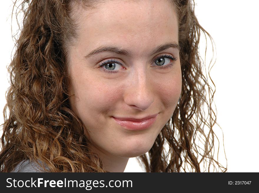 Teen portrait smiling against white background