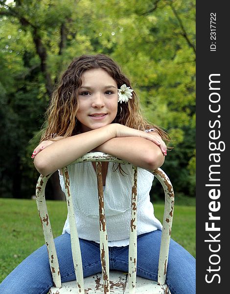 Pretty teen girl poses at the park. A great real people image!. Pretty teen girl poses at the park. A great real people image!