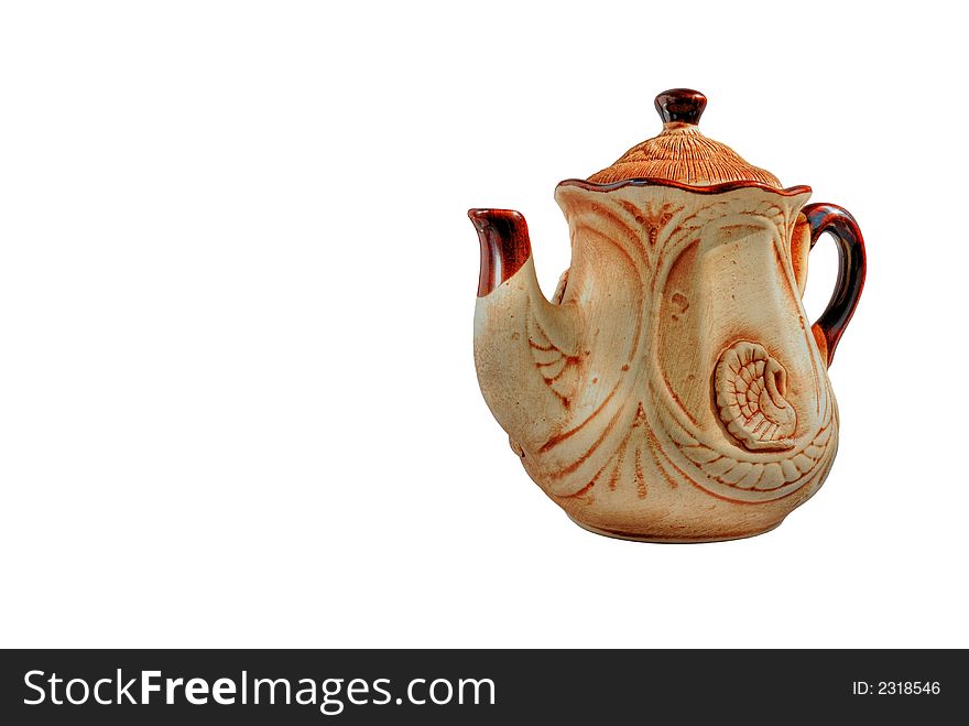 Clay teapot of manual job. Executed under olden time. Craft of masters of the Western Ukraine (no shadow - full isolated). Clay teapot of manual job. Executed under olden time. Craft of masters of the Western Ukraine (no shadow - full isolated)