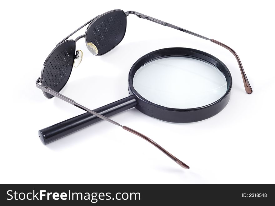 Glasses and magnifier isolated over white background. Glasses and magnifier isolated over white background