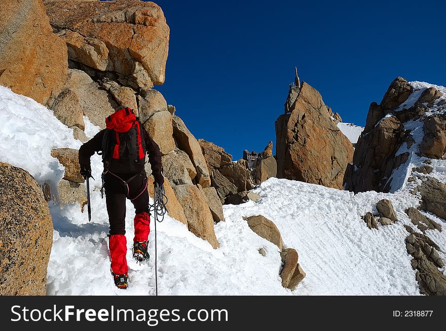 Climber on the Cosmiques ridge, Aiguille du Midi, Chamonix, Mont Blanc, West Alps, France, europe