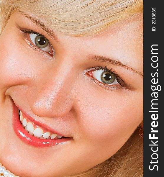 Beautiful young woman face. Close up. Over white background