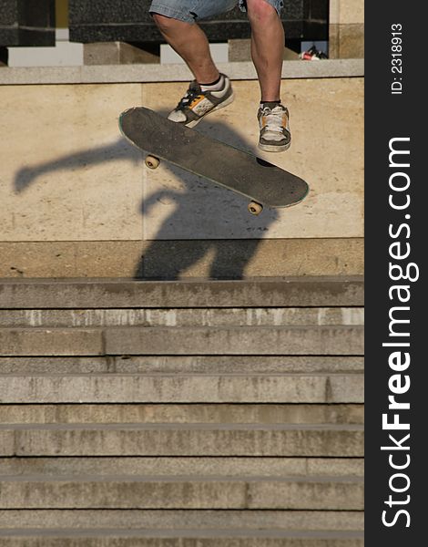 A young man goes on skateboard on stairs. A young man goes on skateboard on stairs