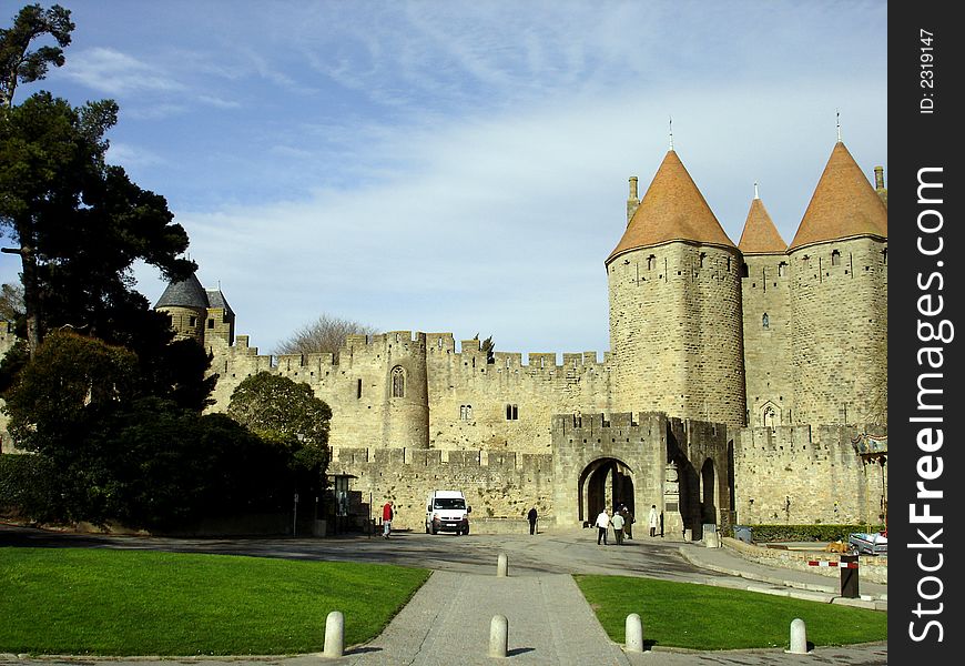 The front entrance gate and wall of the old city of Carcassone, France. The front entrance gate and wall of the old city of Carcassone, France