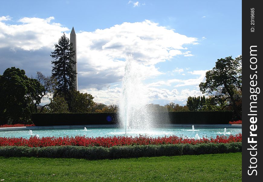Fountain in white house grounds with washington monument in background