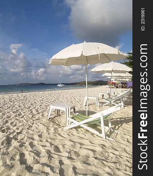 Chairs and parasols on a white sand beach at Koh Samet in Rayong province, Thailand. Chairs and parasols on a white sand beach at Koh Samet in Rayong province, Thailand