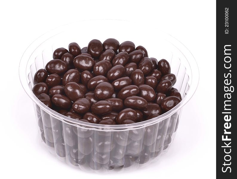 Dark brown dragee, chocolate covered nuts