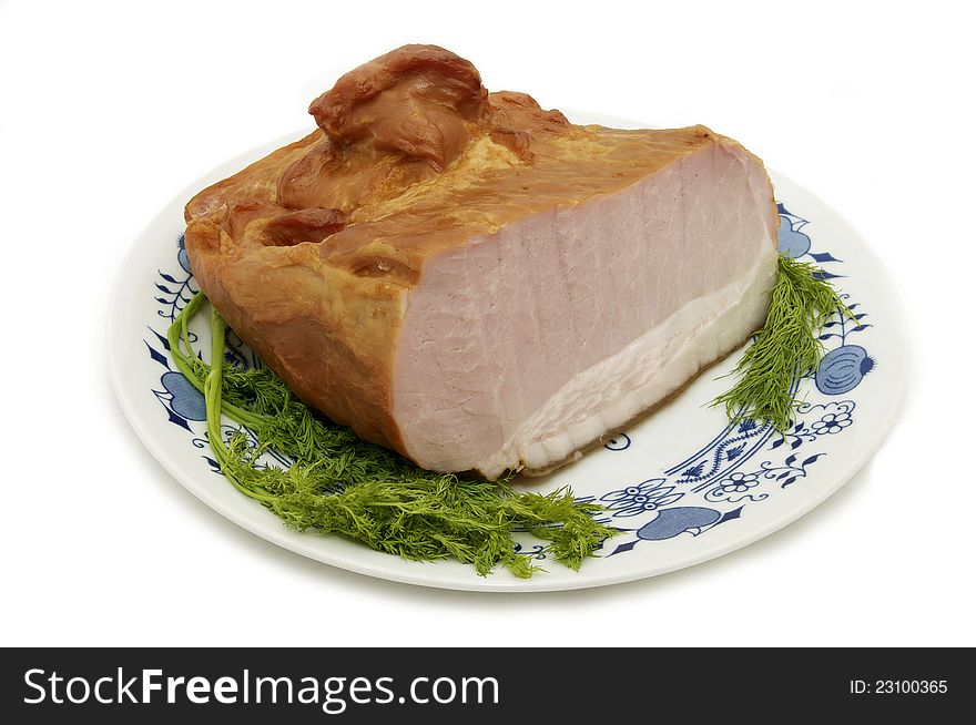 Not a large piece of pork dish on a white background. Not a large piece of pork dish on a white background