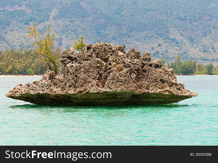 Crystal Rock at Mauritius in turquoise water. Crystal Rock at Mauritius in turquoise water