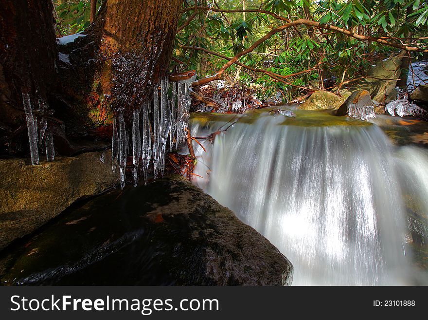 Waterfalls in the mountains in winter with silky flow. Waterfalls in the mountains in winter with silky flow